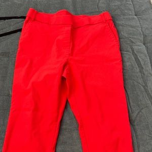 Red textured stretchy work pants.